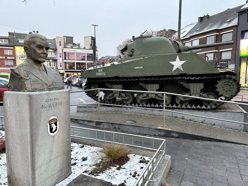 The Sherman tank next to the bust of General McAuliffe