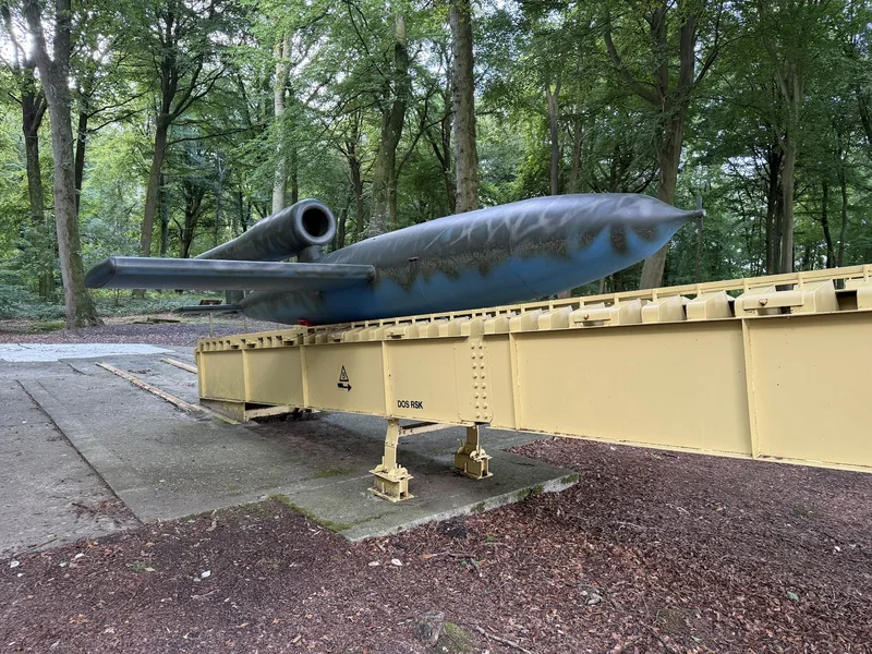 Side view of the replica V1 flying bomb on the launch ramp at Guerville, pulsejet mounted above the fuselage