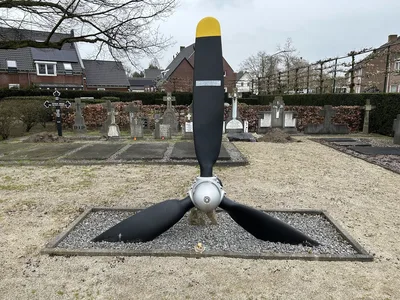 The three-bladed propeller of the C-47 Sonya standing as a memorial in the cemetery at Erp